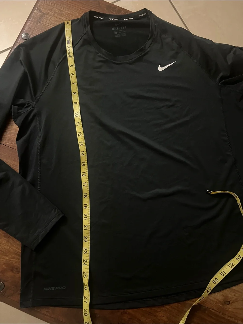 Nike Men’s Black long  Sleeve Performance Tee with White Swoosh